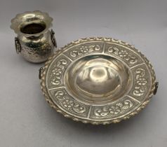 An Oriental embossed three footed dish stamped 900, together with an embossed twin handled pot