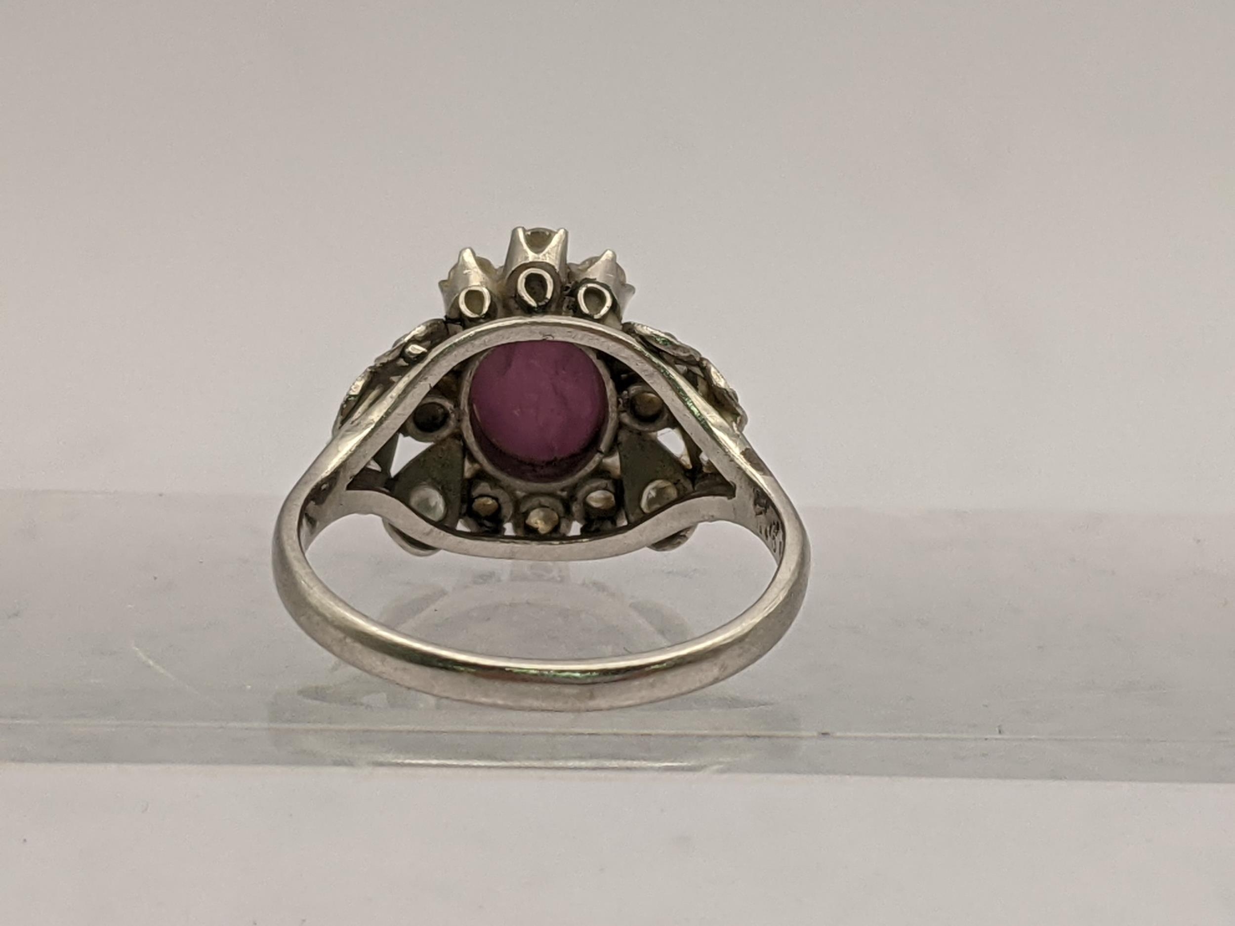 A platinum ring stamped 850 set with a central purple stone and diamonds, total weight 4.4g - Image 3 of 4