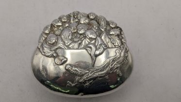 A Chinese silver coloured embossed pot embossed with immortal figures and a dragon with character