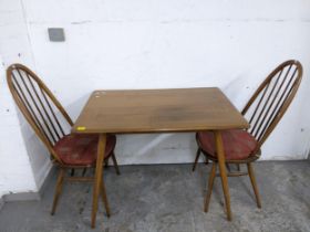 A mid-century Ercol breakfast table, model 393 circa 1960, in Golden Dawn colour with turned spindle