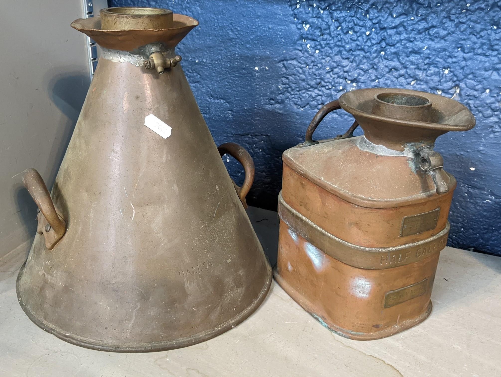 An early 20th century Gaskell & Chambers half gallon petrol measure and a copper gallon jug,