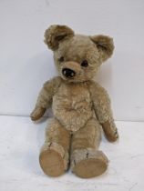 A vintage teddy bear with glass eyes Location: