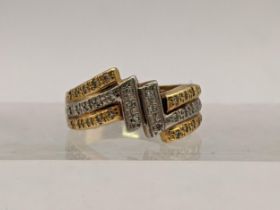 A platinum and 18ct gold ring set with diamonds, total weight 6.1g Location: