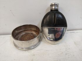 A late 20th century silver wine bottle coasters and Victorian silver and glass hip flask Location: