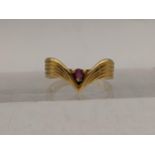 An 18ct gold herringbone style ring set with a ruby, total weight 3g Location: