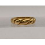 An 18ct gold twist style ring, total weight 3.2g Location: