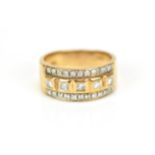 A 9ct gold and diamond dress ring, set with a central row of five bezel set princess cut diamonds,