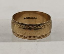 A 9ct gold gents wedding band, having engraved detail, total weight 4.7g Location: