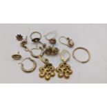 A selection of 9ct gold, gold plated and yellow metal earrings to include a pair of knot earrings,