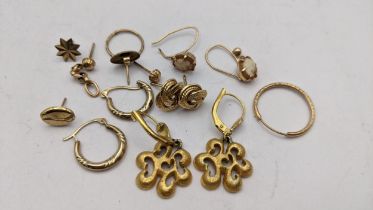 A selection of 9ct gold, gold plated and yellow metal earrings to include a pair of knot earrings,