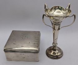 An early 20th century silver cigarette box by Walker & Hall together with a weighted silver four