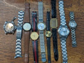 A group of seven mixed fashion wristwatches A/F, along with a ladies Tag Heuer wristwatch Location: