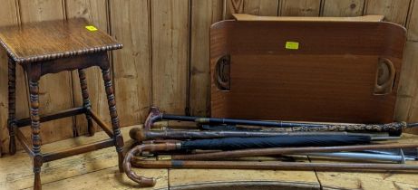 A Paragon Centurion bed table, an oak table, various walking sticks and a tribal club, Location: