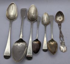 A selection of Georgian silver spoons together with a later spoon, the column fashioned as two