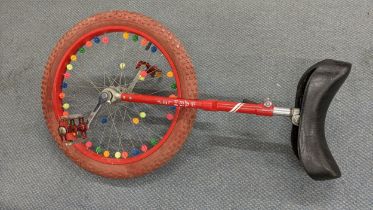 A red Pashley unicycle Location: