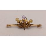 A 9ct gold Scottish thistle brooch inset with an amethyst and two citrines, 2.1g Location: