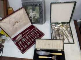 Cutlery and flatware to include a dessert service, fish servers and a pewter photograph frame