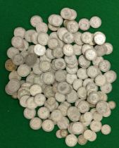 A quantity of pre 1947 British Shillings, together with a small quantity of sixpence and