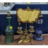 A French 19th century Ormalu bouillotte lamp, a Bohemian glass decanter converted to lamps and a