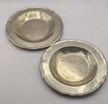 Two white metal Continental plates having crimped edges stamped 900, total weight 390.6g Location: