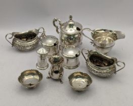 Silver condiments and a cream jug, a French silver mustard, a pair of 800 grade salts, 353.4g,