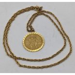 A 9ct gold St Christopher pendant, 5g, together with a gold plated necklace Location: