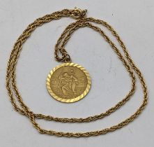 A 9ct gold St Christopher pendant, 5g, together with a gold plated necklace Location: