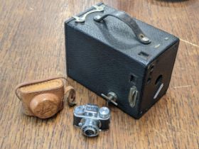 A vintage Japanese Hit camera in fitted leather case, along with a Brownie camera, Location: