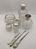 Silver topped and handled dressing table items to include two scent bottles, A/F, salt jar, button