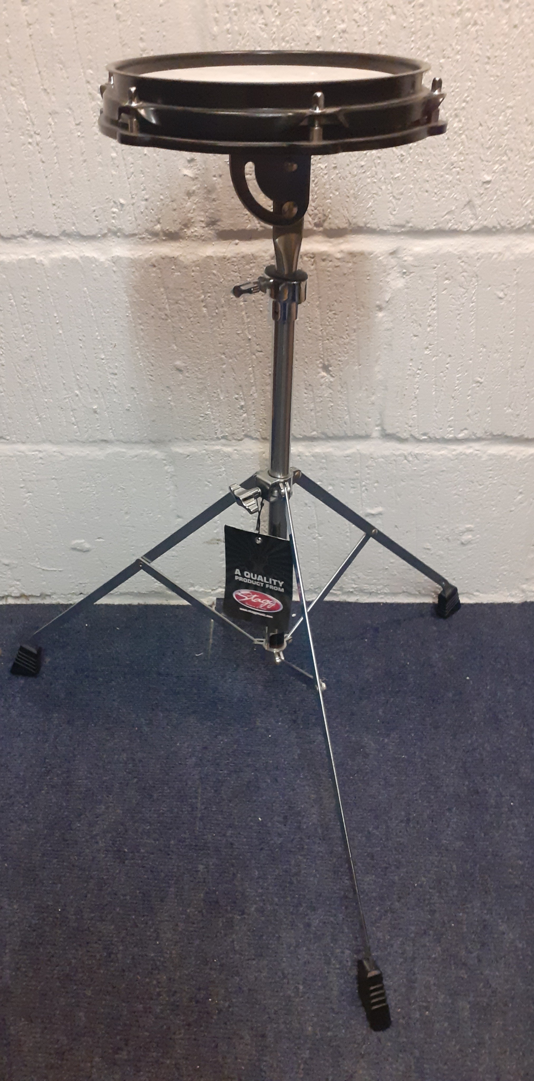 A Stagg practice/training drum on folding and adjustable stand, new with original tags. Location:RWM