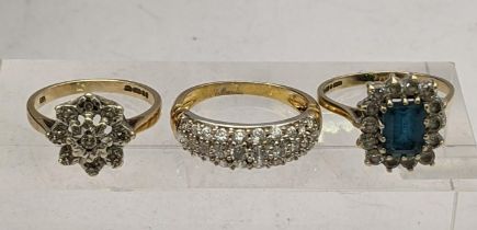 A 9ct gold and diamond floral cluster ring, along with a 9ct gold blue Zircon style ring, with a