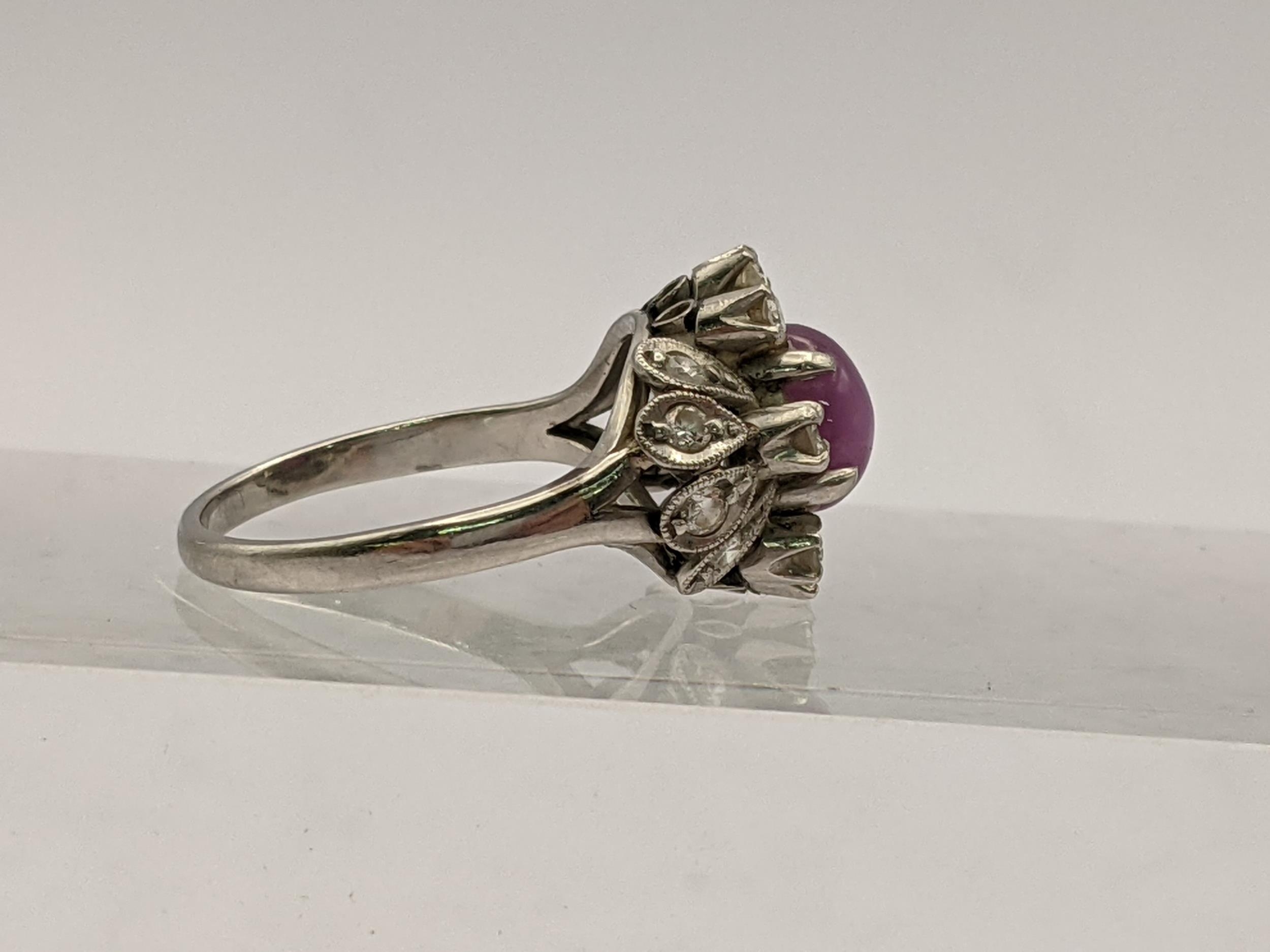 A platinum ring stamped 850 set with a central purple stone and diamonds, total weight 4.4g - Image 2 of 4