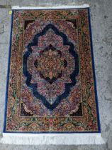 A contemporary small Persian style, machine woven rug, floral design surrounded by a central
