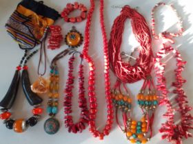 Vintage Worldwide jewellery to include red coral necklaces, a multi-string necklace of faux coral,