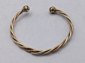 A yellow metal bi coloured interlocking design bracelet A/F 6.3g Location: