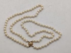 A pearl necklace on a 9ct gold clasp Location: