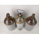 Three Nicholson, Maidehead flagons; a 1 gallon tap jar and 2 gallon flagons