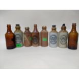 Six Nicholson, Maidenhead stoneware ginger beer bottles including a rare crown cap example, plus two