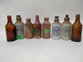 Six Nicholson, Maidenhead stoneware ginger beer bottles including a rare crown cap example, plus two