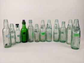 Twelve Williams & Dean, Windsor mineral water bottles to include three Beavis patent Codds and a