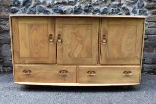 A mid century blonde elm Windsor sideboard by Ercol,