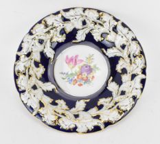 A large Meissen porcelain dish, with hand painted floral composition to the centre, and gilded