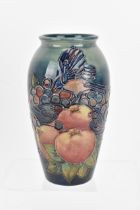 A Moorcroft pottery 'Finches and Fruit' vase designed by Sally Tuffin, 1990s, of tapering shouldered