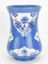 A William Moorcroft (1872-1945) powder blue Florian vase, circa 1920-30, of waisted form with