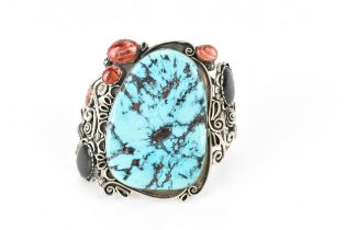 A Native American Navajo white metal, turquoise, abalone and spiny shell cuff bracelet