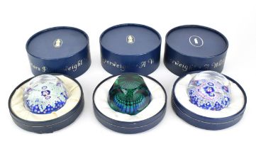 A group of three boxed Whitefriars glass paperweights, each facet cut examples with millefiori cane,
