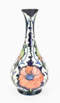 A Moorcroft pottery 'Poppy' pattern vase, of baluster form with long neck, decorated with tube-lined