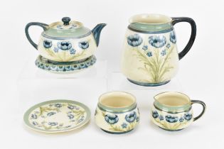 A William Moorcroft (1872-1945) for James Macintyre & Co 'Blue Poppy' pattern part tea set, circa