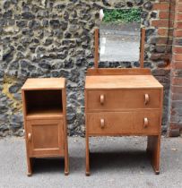 An early 20th century limed oak Heal's dressing table and matching side table, circa 1930s, the