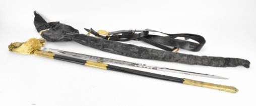 An early 20th century British naval dress sword, with original cover and belt, the blade with